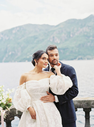Wedding couple posing for a husband & wife portrait after their wedding ceremony at Villa Aura Del Lago