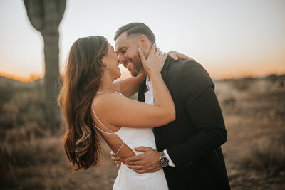 couple kissing during desert elopement