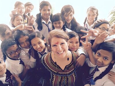 Smiling school girls in Nepal with Celeste Mergens