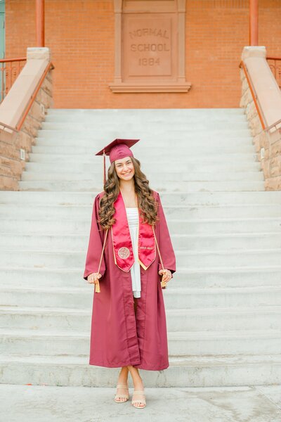 senior girl at ASU at old Maine smiling at camera 