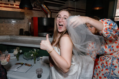 Newlyweds holding hands and walking back up the aisle