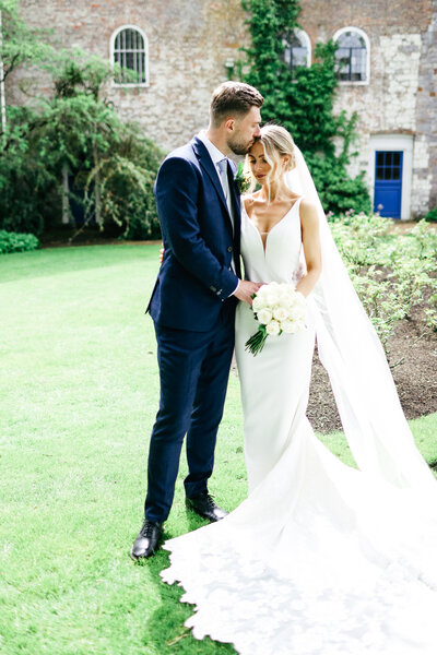 groom-holding-bride-at-luxury-destination-wedding-in-port-grimaud