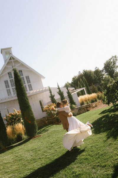 bride and groom daning infront of church 