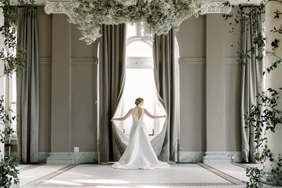 Bride standing in the window at her Georgian Hall wedding in Athens