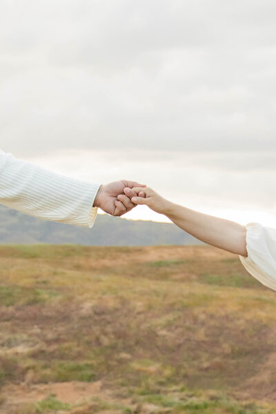 Close up of couple holding hands | California Maternity Session