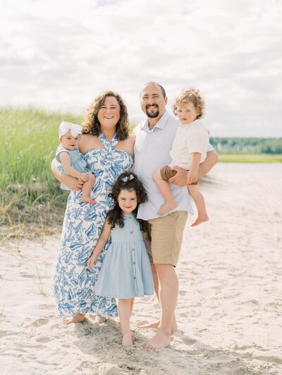 family of five pose for family photos in maine by By Carrie Pellerin