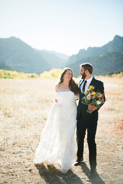 Couple walking in the mountains during their Snowmass Wedding