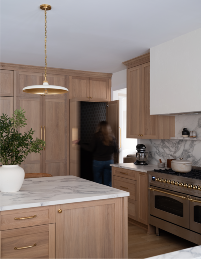Project image of farmhouse kitchen with wooden cabinetry and white marble counters, by Alexa at Home