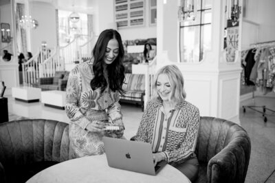 Dr. Brooks and Dr. Templeton, orthodontists in Nashville, TN working on a laptop in black and white