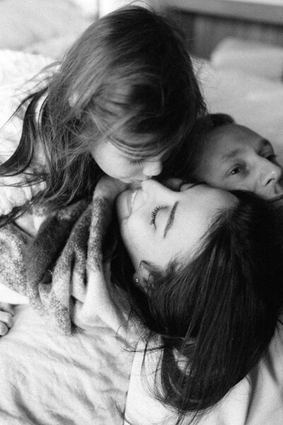 mum holding baby smiling