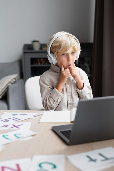adorable-little-boy-doing-online-session-speech-therapy (1)