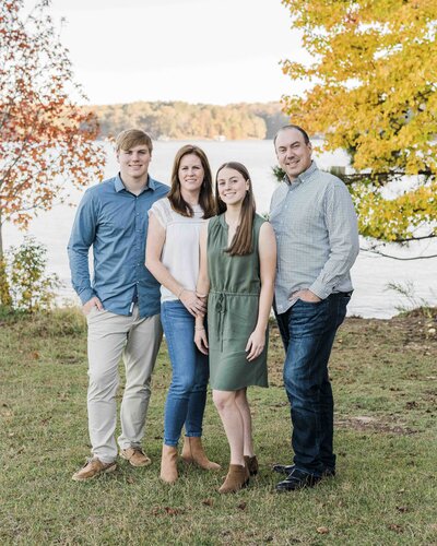 family in front of waterfront