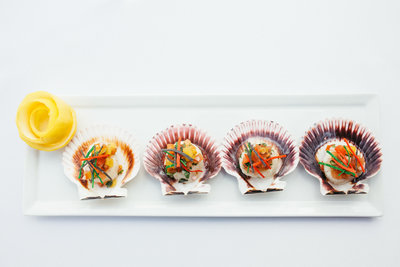 Scallops prepared on a clam shell for a wedding reception