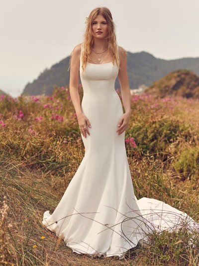 Affordable Princess Wedding Dress. A princess wedding dress with elegant details, this slim A-line features a sheer bodice accented in lace motifs, completing the illusion jewel over sweetheart neckline and illusion back. Shimmering tulle skirt trimmed in horsehair for a voluminous look. Finished with covered buttons over zipper closure.