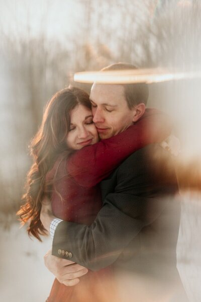 Woman-and-man-hugging-with-Light-Leaks-around-them