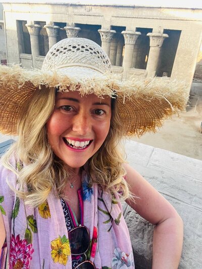 Katie, founder of Mystical Living, smiling for a photo, radiating joy and purpose as she inspires others to craft a life of awe, wonder, and transformation.