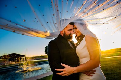 bride and groom at sunset at grace gardens wedding venue In el paso texas