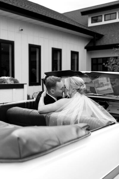 A couple shares a romantic moment at a luxury venue in Minnesota, captured in timeless and fine art style.