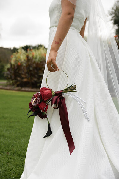 Personalised signage for wedding ceremony with flower arrangement for styling. 