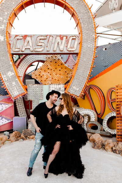 This couple wore Vegas themed attire for their Neon Museum Elopement in Las Vegas