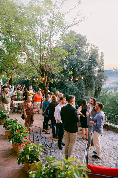 A wedding photo of guests during cocktail hour at Laticastelli in Tuscany Italy