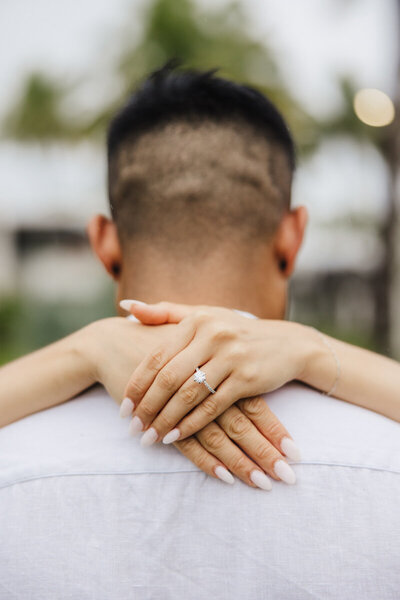 arms around fiance showing off ring