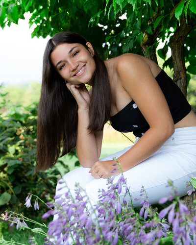senior picture of a girl in flowers from Victor NY
