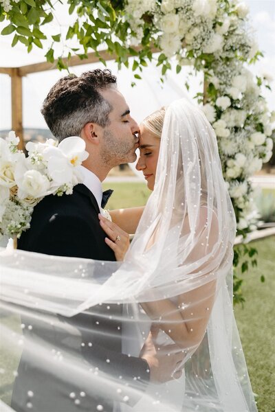 wedding couple under huppa