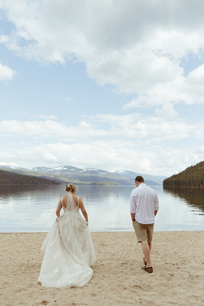 Bride & Groom Walking Together Lakeside - Terra & Zack | Elkins Resort Priest Lake Idaho Wedding