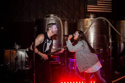 Female lead singer performing high-energy pop and rock music with The Tonic Connecticut cover band
