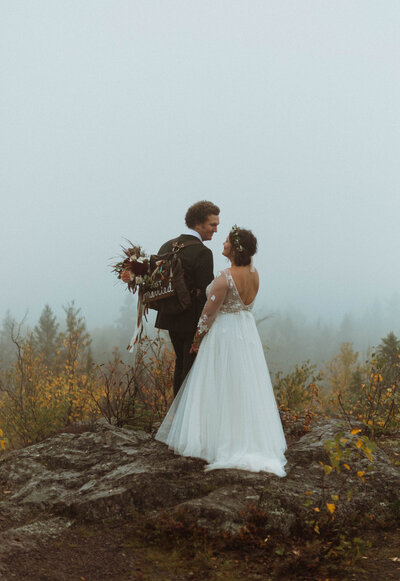 A midwest elopement enjoying the fall leaves and cool breeze in northern minnesota. Overlooking lake superior, two people say yes to each other forever.