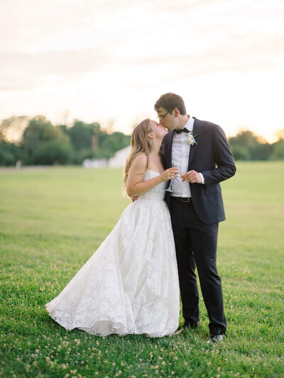 Bride and groom kissing at the Inn at Vint Hill. Captured by Washington DC Wedding Photographer Bethany Aubre Photography.