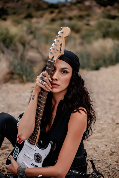 woman holding guitar photo