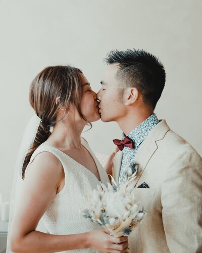 Bride and groom kissing