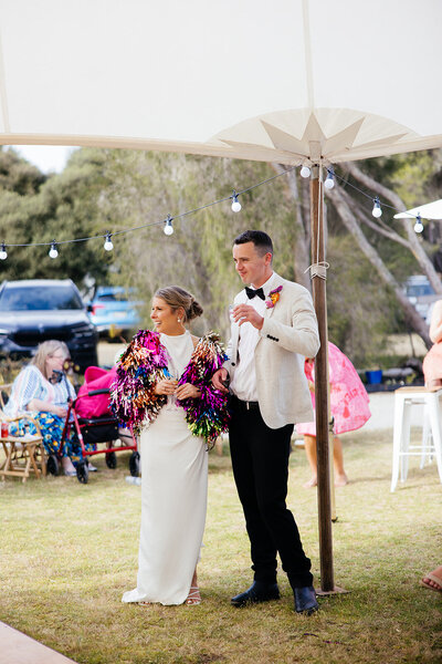 Personalised signage for wedding ceremony with flower arrangement for styling. 