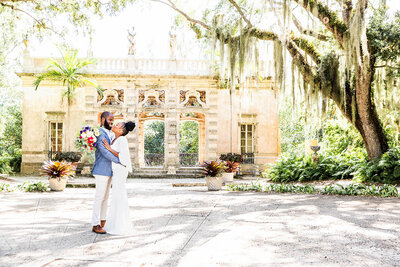 Miami Wedding Photographer: Photo of newlywed couple at The Vizcaya Museum and Gardens. Captured by photographers from White House Wedding Photography.