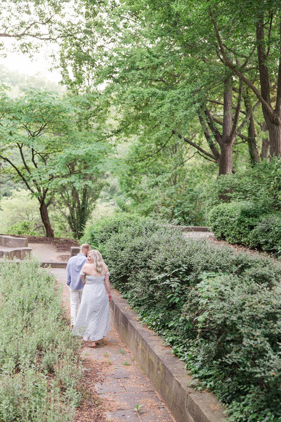 Bride and groom walk up memorial steps at their DC wedding