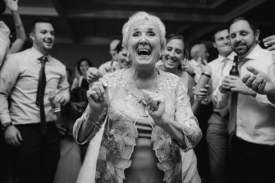 Black and white photo  of grandmother dancing at wedding.
