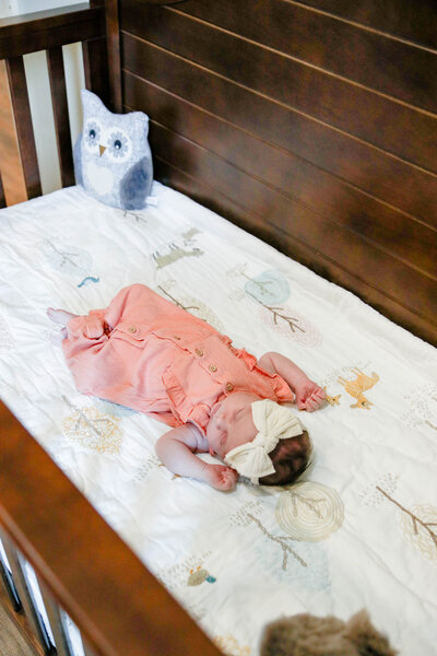 Photo of newborn lying in crib | Maine Maternity Photography