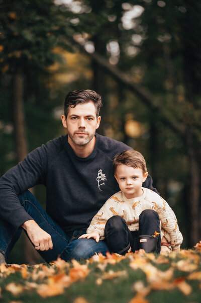 Dad and son photo sitting in leaves