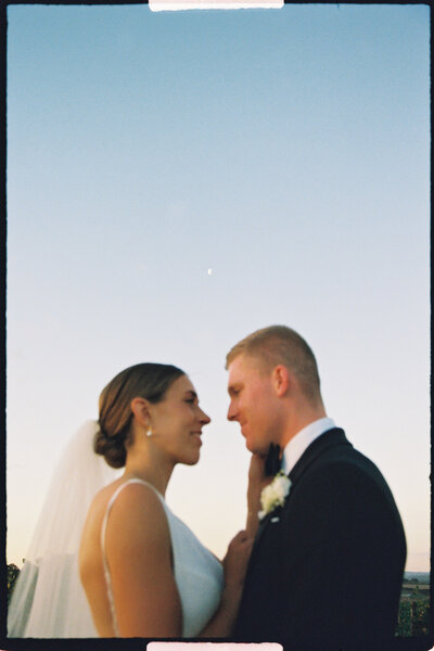 detail shot of brides jewelry and flowers
