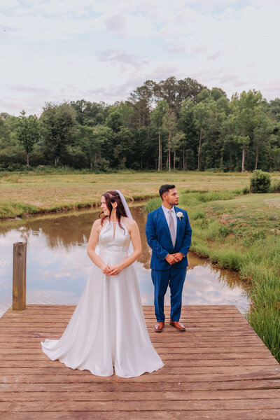 A couple looks in opposite directions