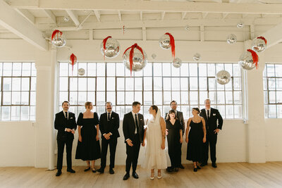 Wedding party taking photos during cocktail hour at luxury wedding in Los Angeles.