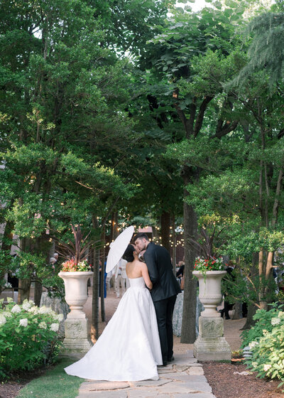 A bride leaving the iron gates of the ceremony just after getting married