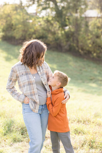 Casual mom and son hugging and looking at each other at Phillips Park in Beavercreek, Ohio.