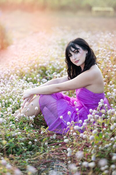 high school senior girl surrounded by blooms of a Bradley Pear tree.  Senior photograph