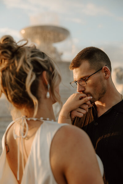 fiance-kissing-fiancees-hand-meg-pearson-photography-midwest