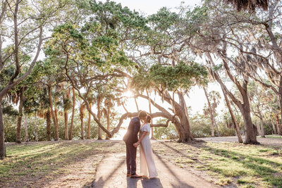 A tranquil elopement at Abercrombie Park on Boca Ciega Bay, with lush greenery, ancient oak trees, and a peaceful natural setting.