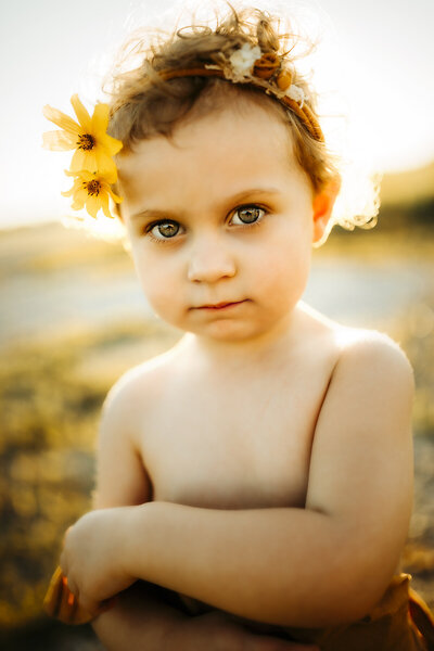 flower child looks into camera during photo session