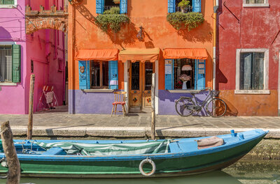 Venice landmark, Burano island canal, colorful houses and boats, Italy, Europe